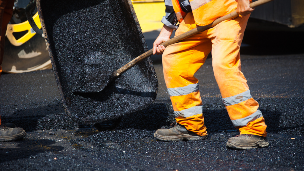 man working with asphalt